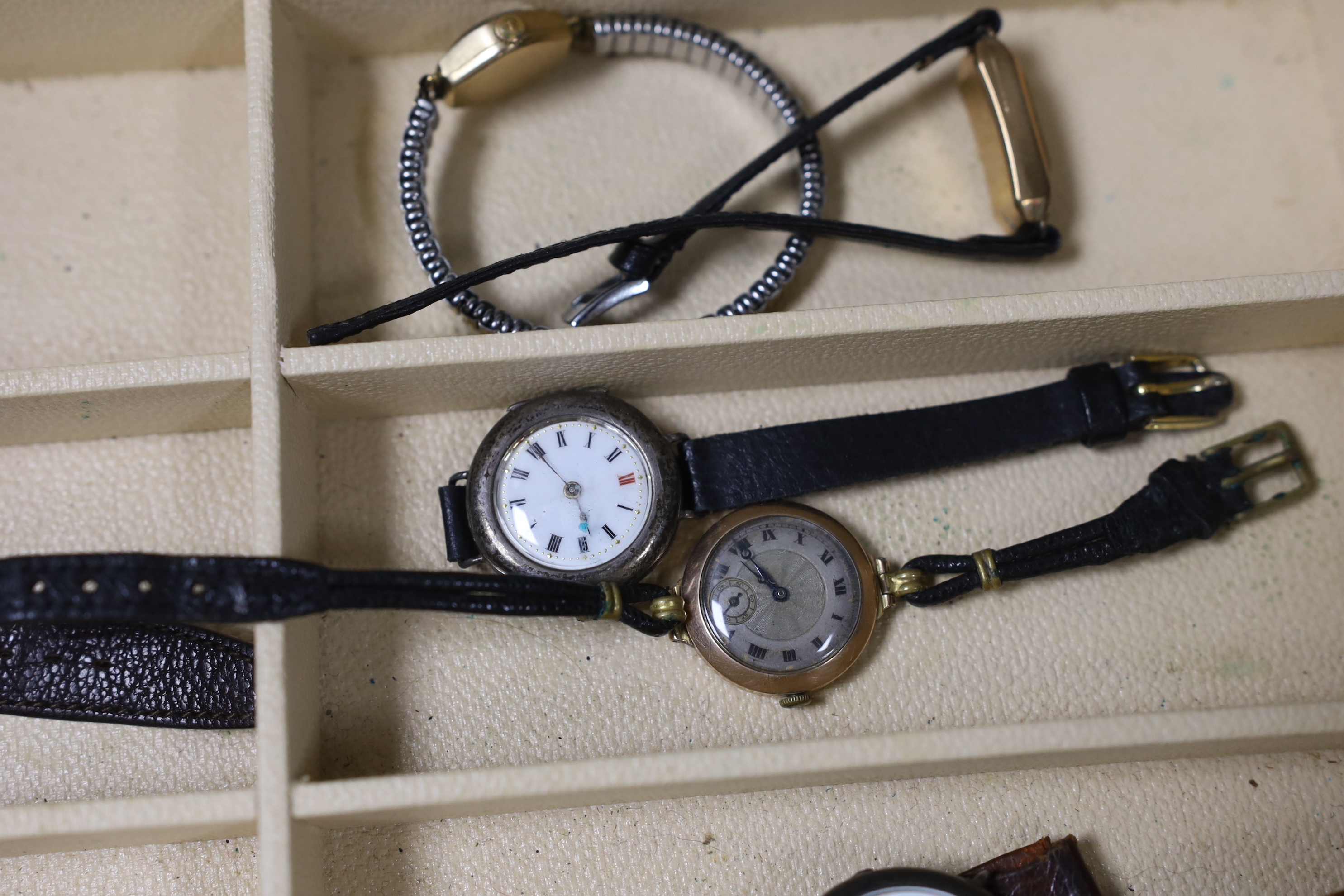 Seventeen assorted lady's or gentleman's wrist watches including a silver manual wind Omega, circa 1917 and a stainless steel Tudor, together with a pedometer?